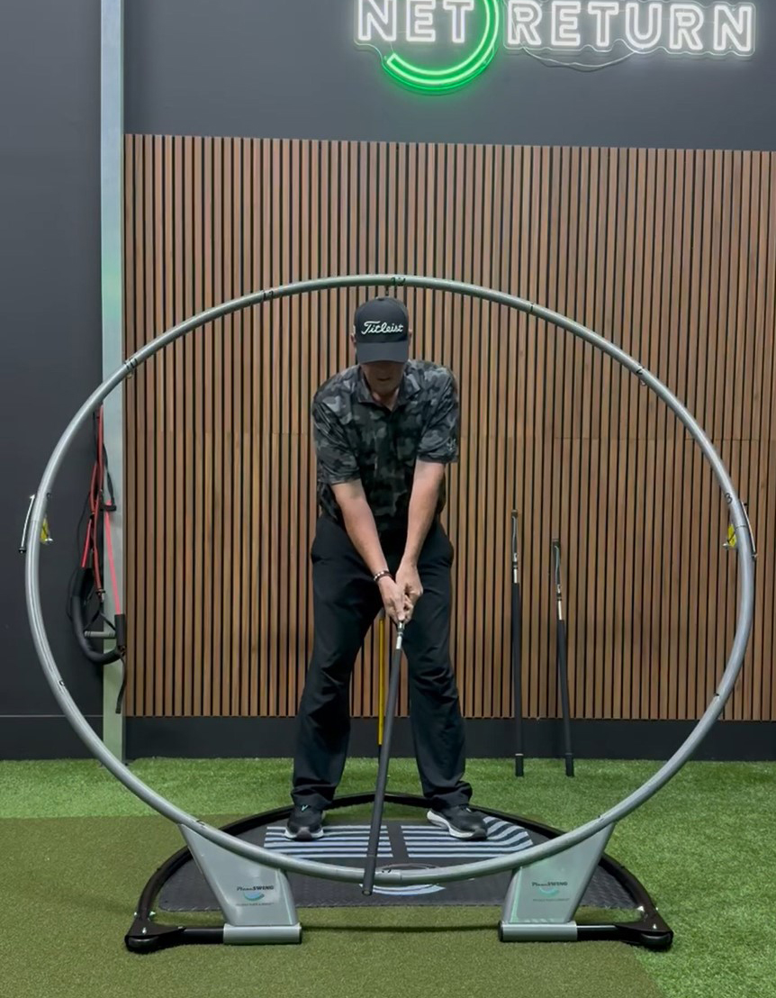 Image of golfer on planeswing training tool